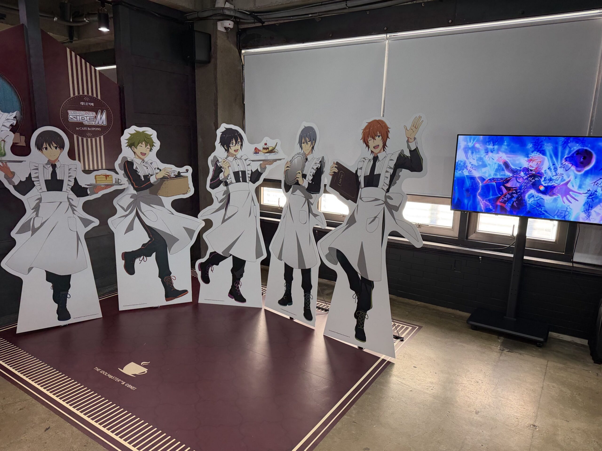Life-size standees line up just inside the door